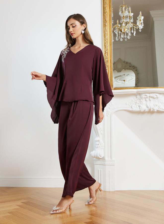 ستايلي طقم منسق من بنطال بأرجل واسعة وبلوزة منمقة - Image 2